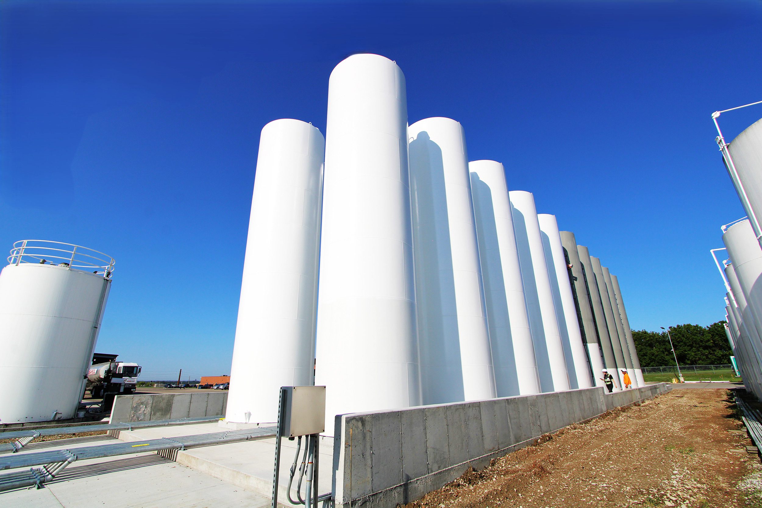 Storage tanks at an industrial facility with high performance coating applied