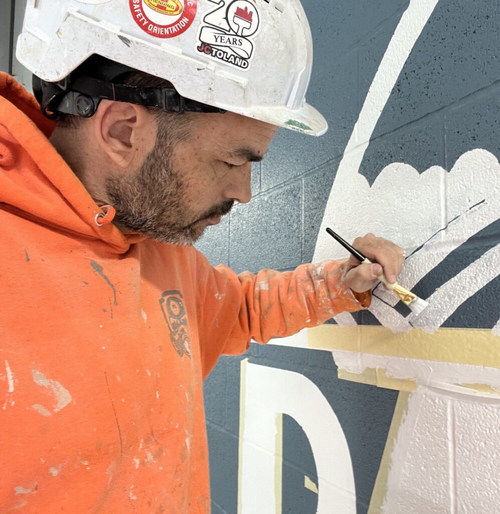 Jon Watkins, 2026 q2 employee of the month, doing a detailed paint job.